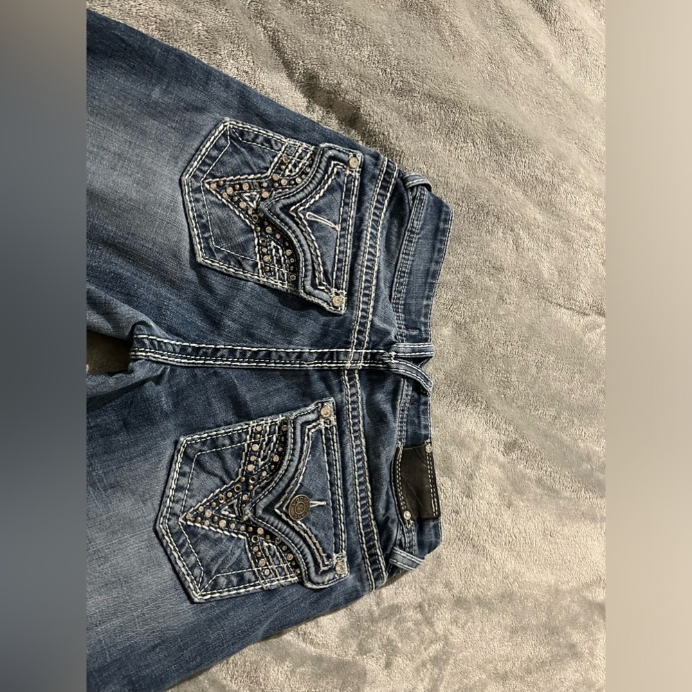 “Vigoss” jeans.